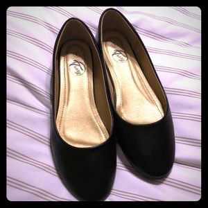 Black faux leather flats
